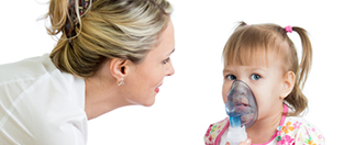 Doctor holding inhaler mask for kid breathing, hospital